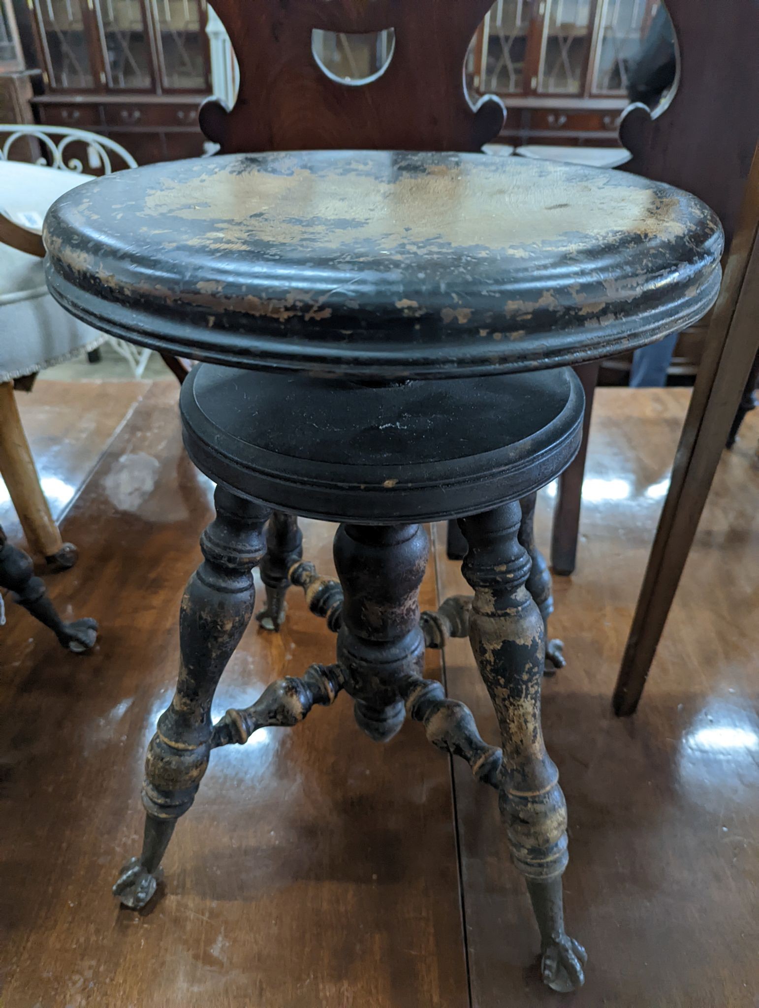 A near pair of Victorian mahogany and beech adjustable stools with revolving seats, larger diameter 36cm